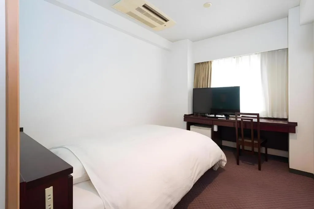 Bed in Oita Century Hotel