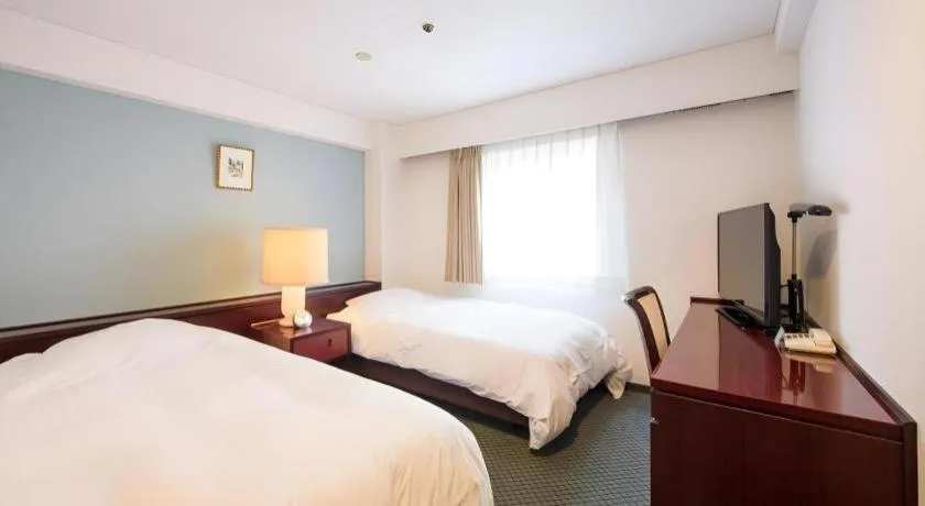 Bed in Oita Century Hotel