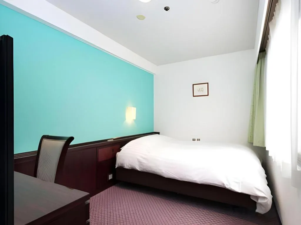 Bed in Oita Century Hotel