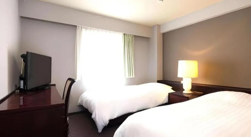 Bed in Oita Century Hotel