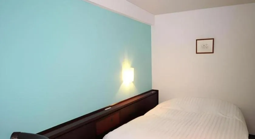 Bed in Oita Century Hotel