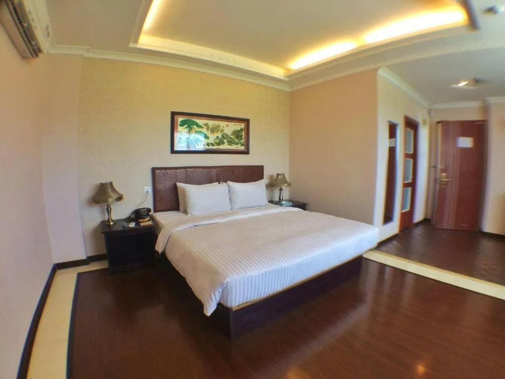 Bed in Grand Hoyah Hotel