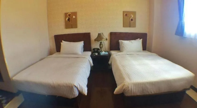 Bed in Grand Hoyah Hotel