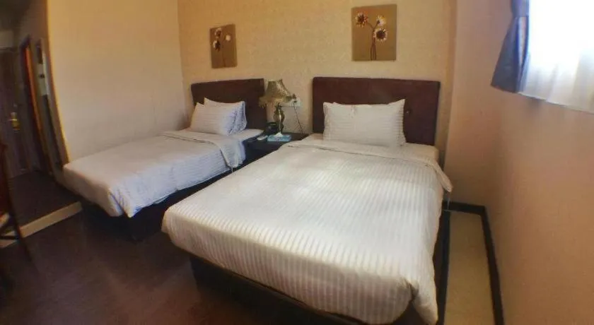 Bed in Grand Hoyah Hotel