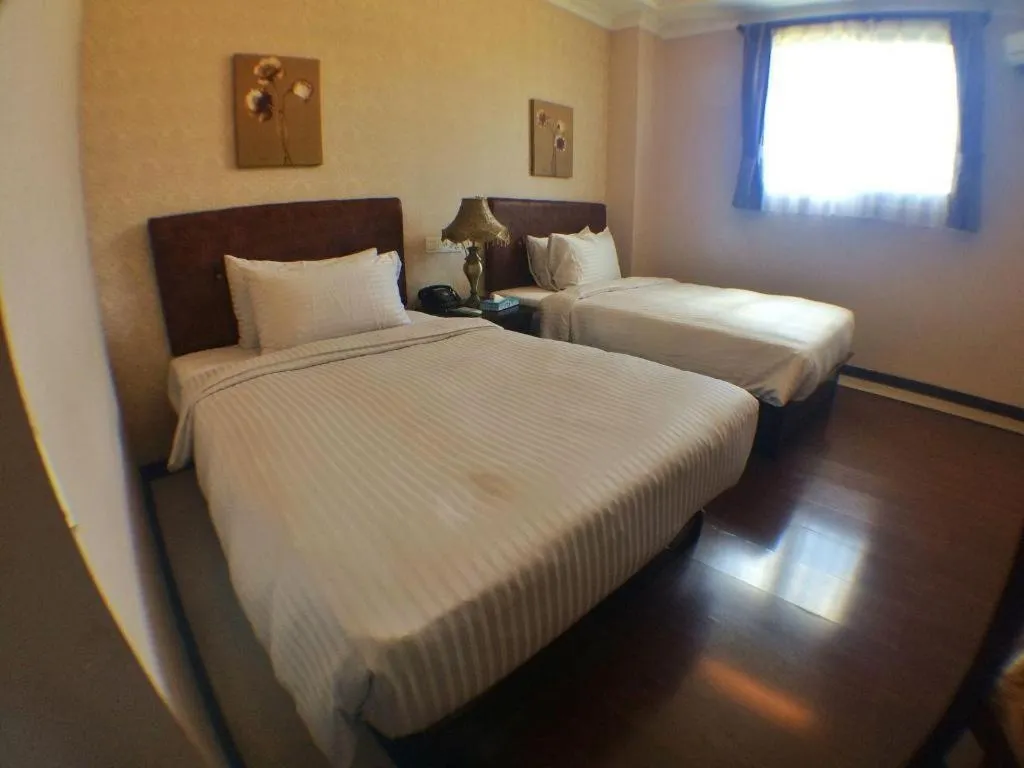 Bed in Grand Hoyah Hotel