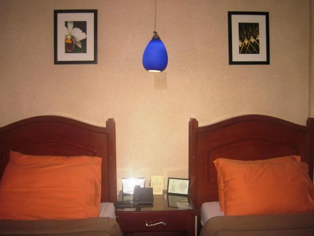 Bed in Alicia Hotel & Restaurant