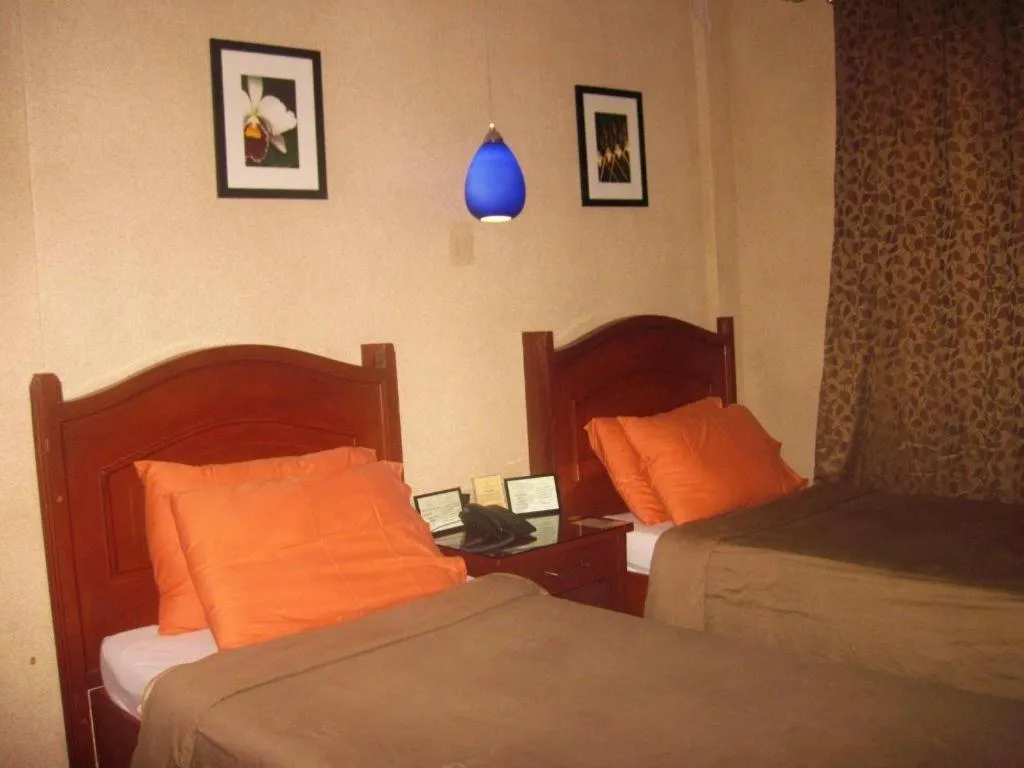 Bed in Alicia Hotel & Restaurant