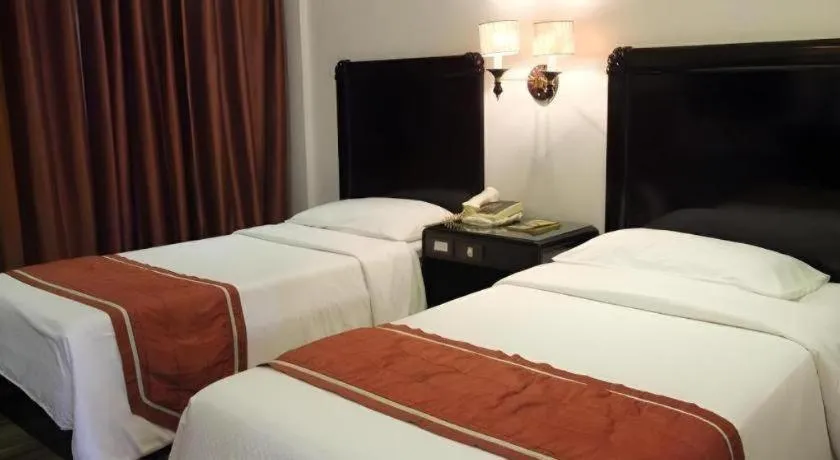Bed in Alicia Hotel & Restaurant