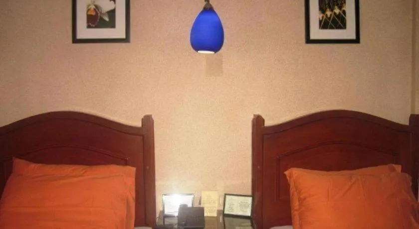 Bed in Alicia Hotel & Restaurant