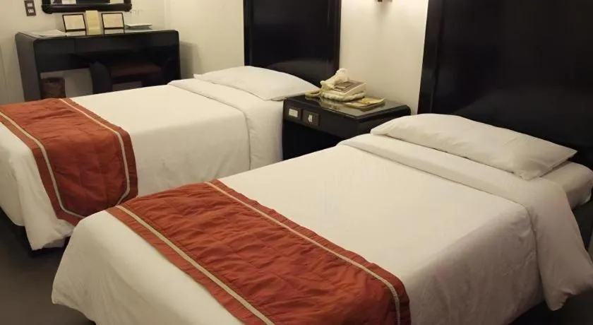 Bed in Alicia Hotel & Restaurant