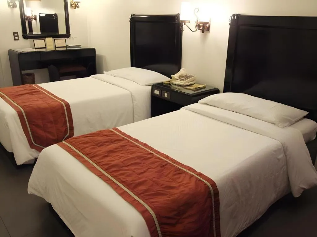 Bed in Alicia Hotel & Restaurant