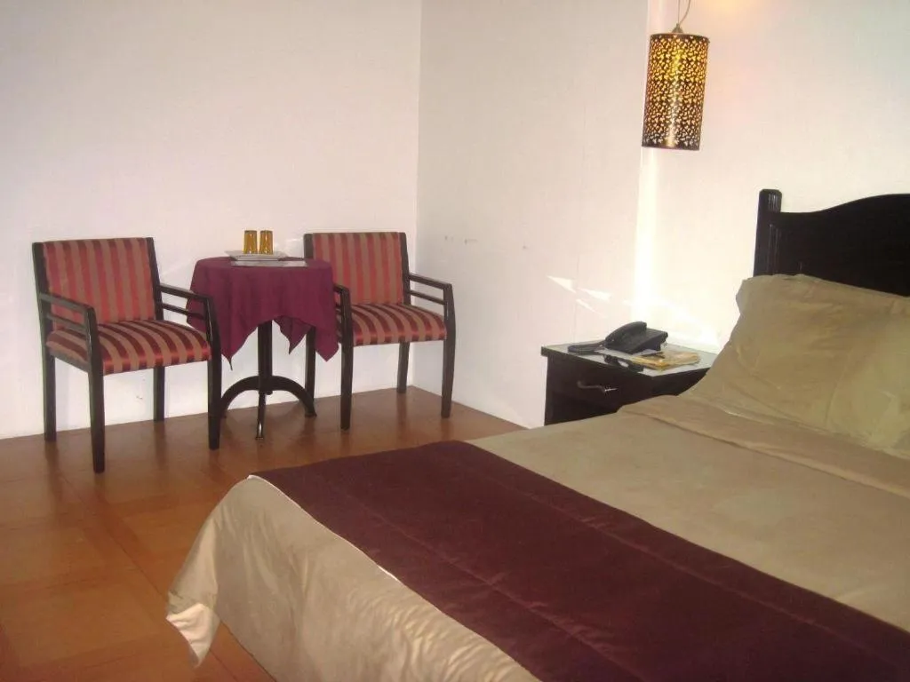 Bed in Alicia Hotel & Restaurant