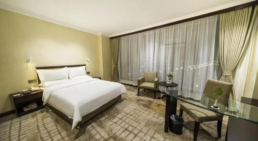 Bed in Jincheng Pacific Hotel Bed in Jincheng Pacific Hotel