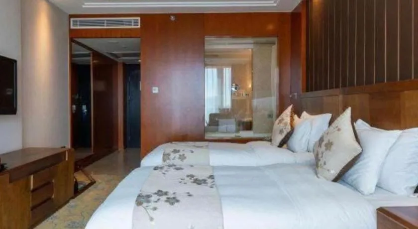 Bed in Qingdao Haidu Hotel