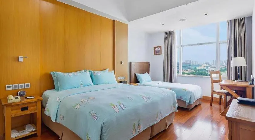 Bed in Qingdao Haidu Hotel