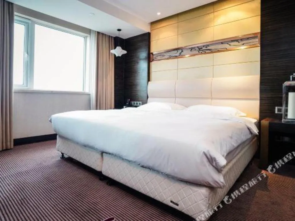 Bed in Grand Metropark Hotel Qingdao