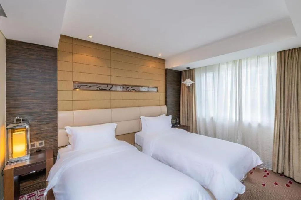 Bed in Grand Metropark Hotel Qingdao