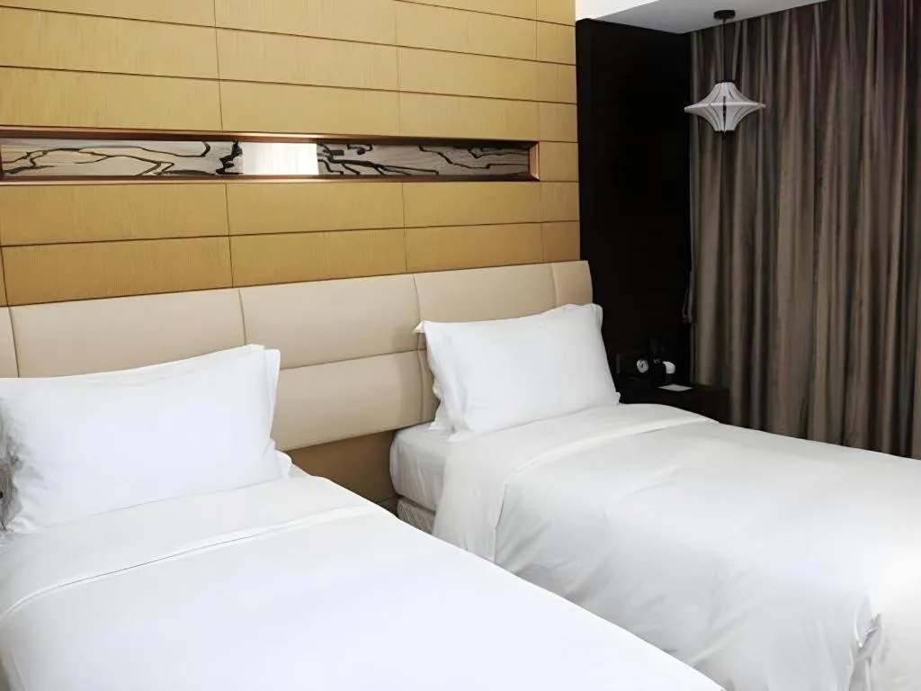 Bed in Grand Metropark Hotel Qingdao