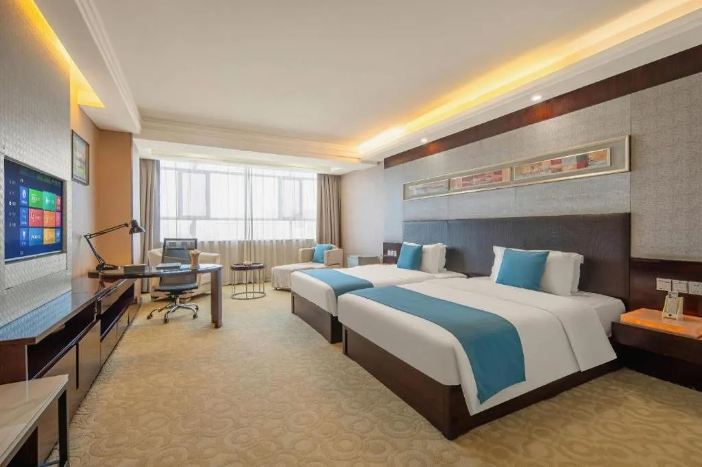 Bed in Aksu Pudong Holiday Hotel