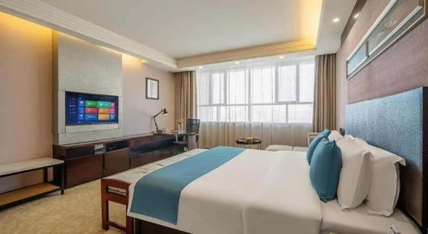 Bed in Aksu Pudong Holiday Hotel