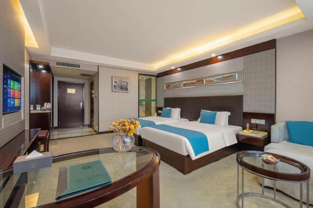 Bed in Aksu Pudong Holiday Hotel