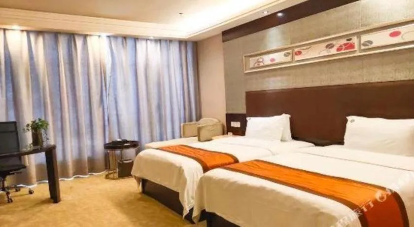 Bed in Aksu Pudong Holiday Hotel