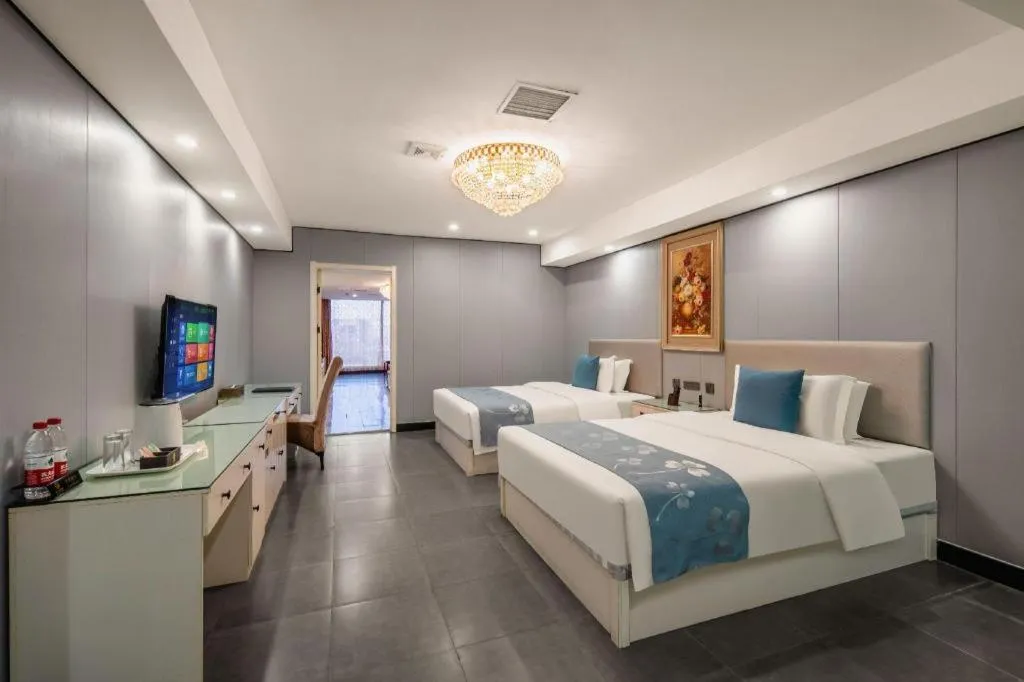 Bed in Aksu Pudong Holiday Hotel