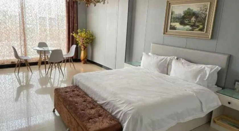 Bed in Aksu Pudong Holiday Hotel