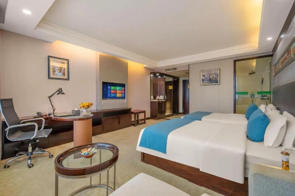 Bed in Aksu Pudong Holiday Hotel