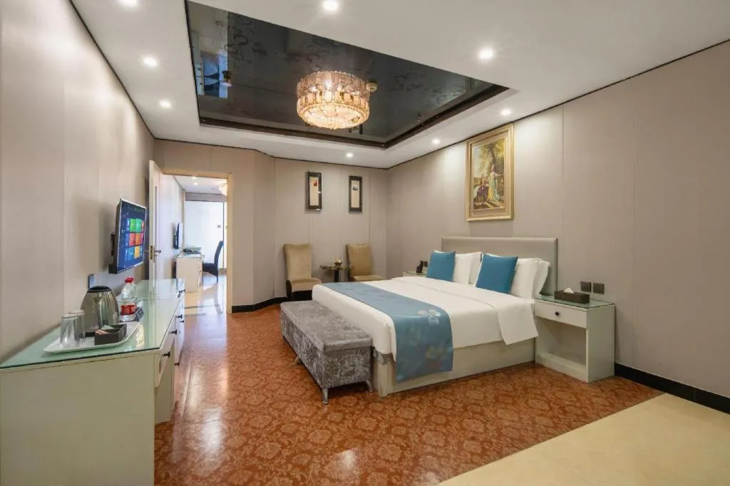 Bed in Aksu Pudong Holiday Hotel