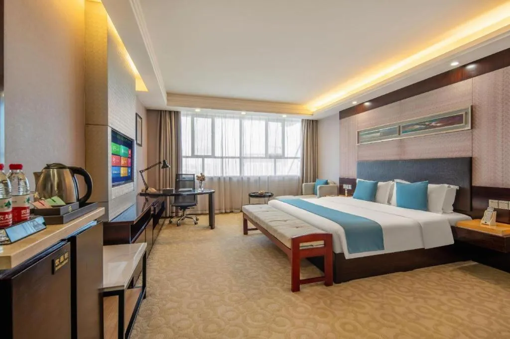 Bed in Aksu Pudong Holiday Hotel