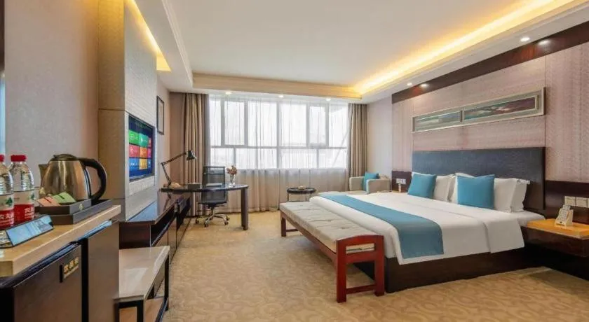 Bed in Aksu Pudong Holiday Hotel