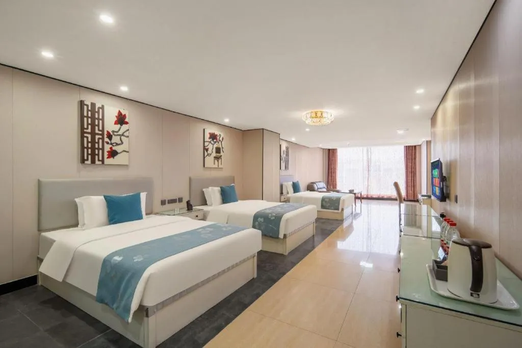 Bed in Aksu Pudong Holiday Hotel