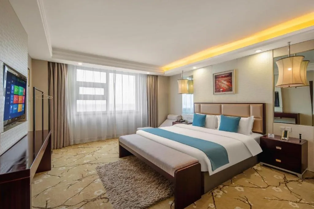 Bed in Aksu Pudong Holiday Hotel