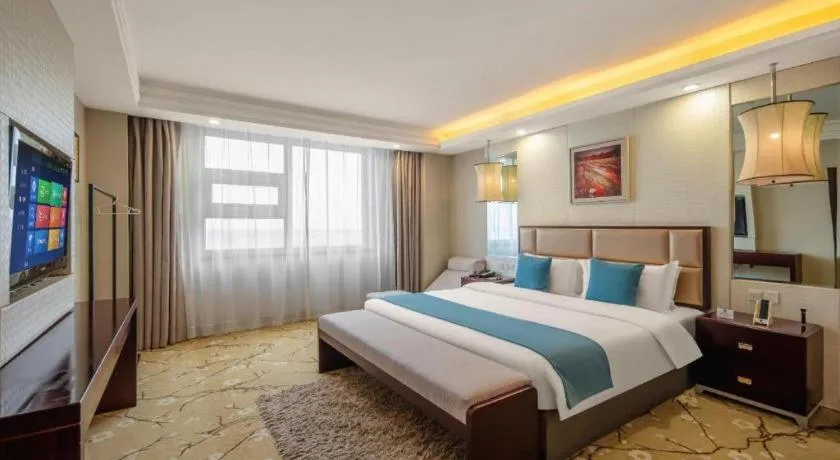 Bed in Aksu Pudong Holiday Hotel