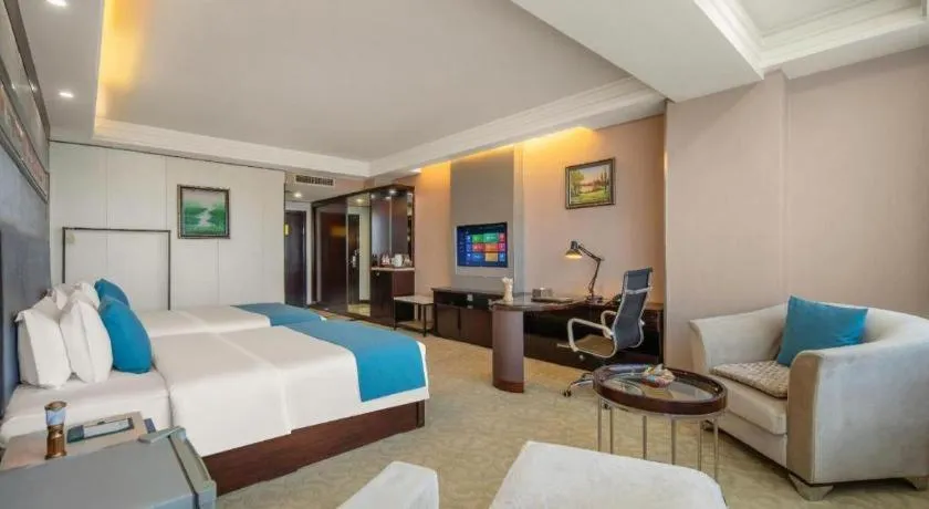 Bed in Aksu Pudong Holiday Hotel