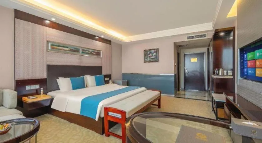 Bed in Aksu Pudong Holiday Hotel