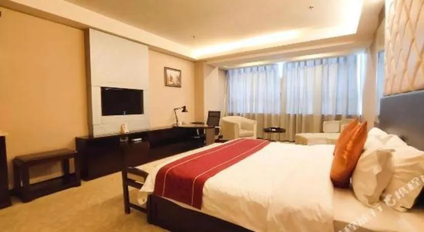 Bed in Aksu Pudong Holiday Hotel