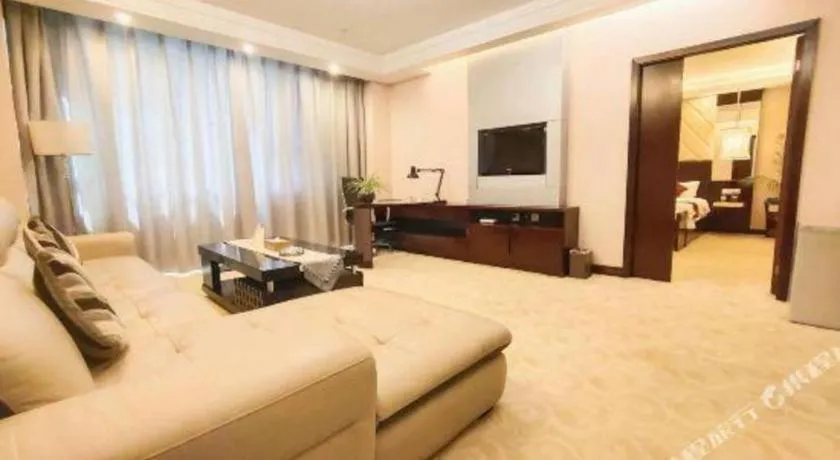 Bed in Aksu Pudong Holiday Hotel