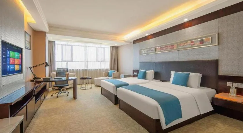 Bed in Aksu Pudong Holiday Hotel