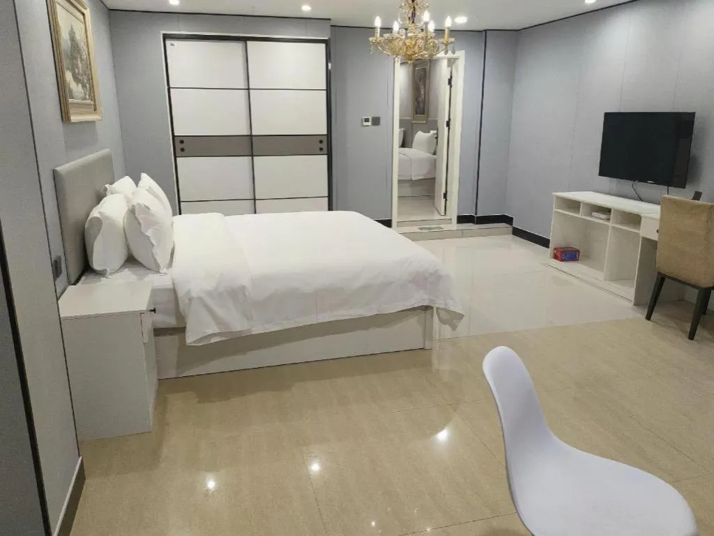 Bed in Aksu Pudong Holiday Hotel