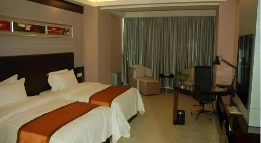 Bed in Aksu Pudong Holiday Hotel