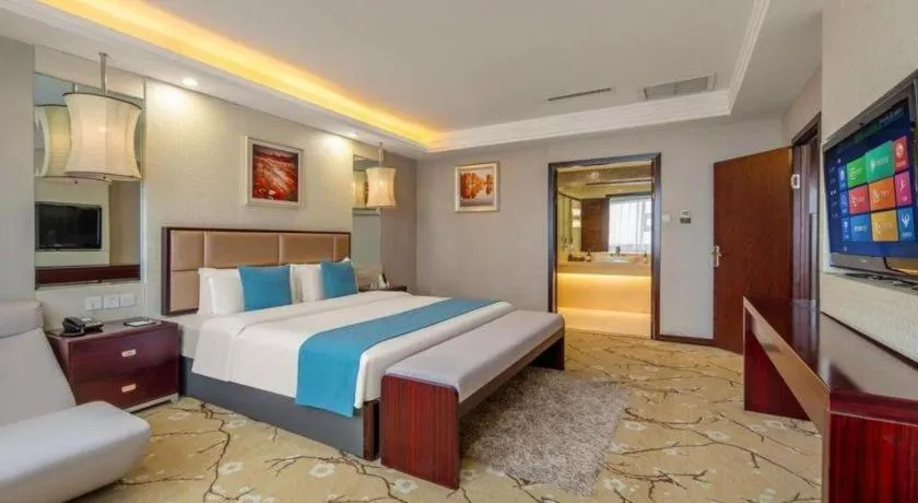 Bed in Aksu Pudong Holiday Hotel