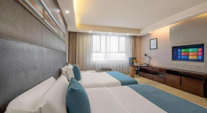 Bed in Aksu Pudong Holiday Hotel