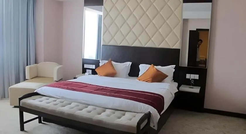 Bed in Aksu Pudong Holiday Hotel