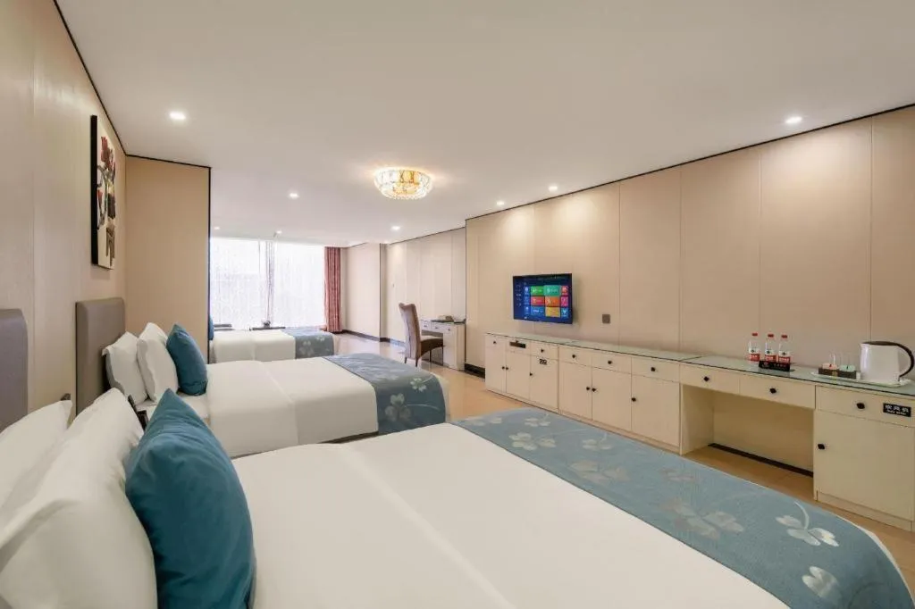 Bed in Aksu Pudong Holiday Hotel