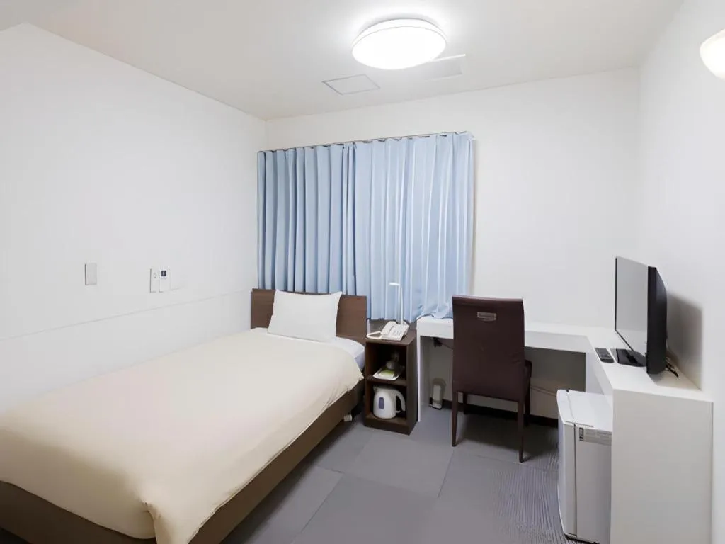 Bed in Ikebukuro Royal Hotel Higashiguchi