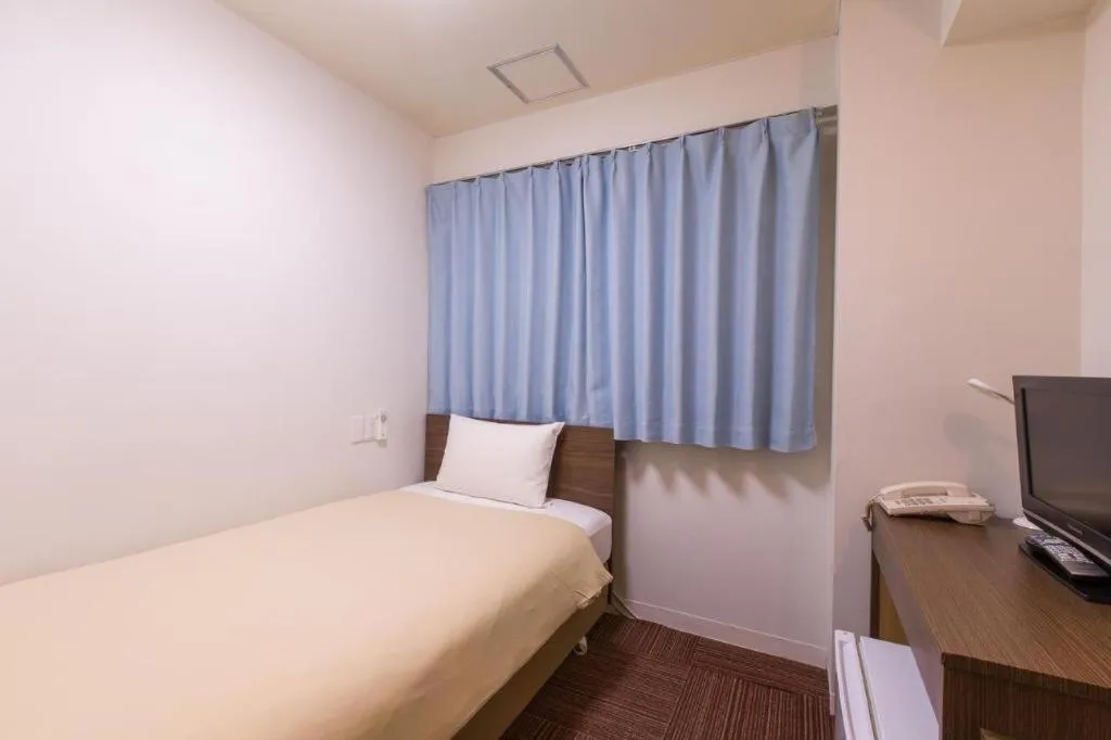 Bed in Ikebukuro Royal Hotel Higashiguchi