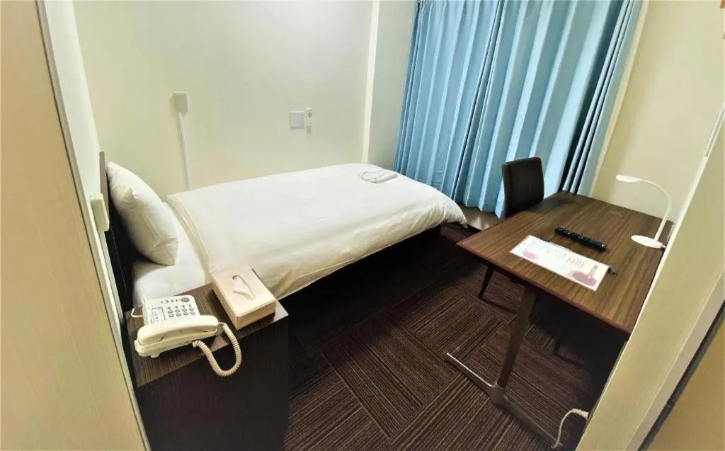 Bed in Ikebukuro Royal Hotel Higashiguchi