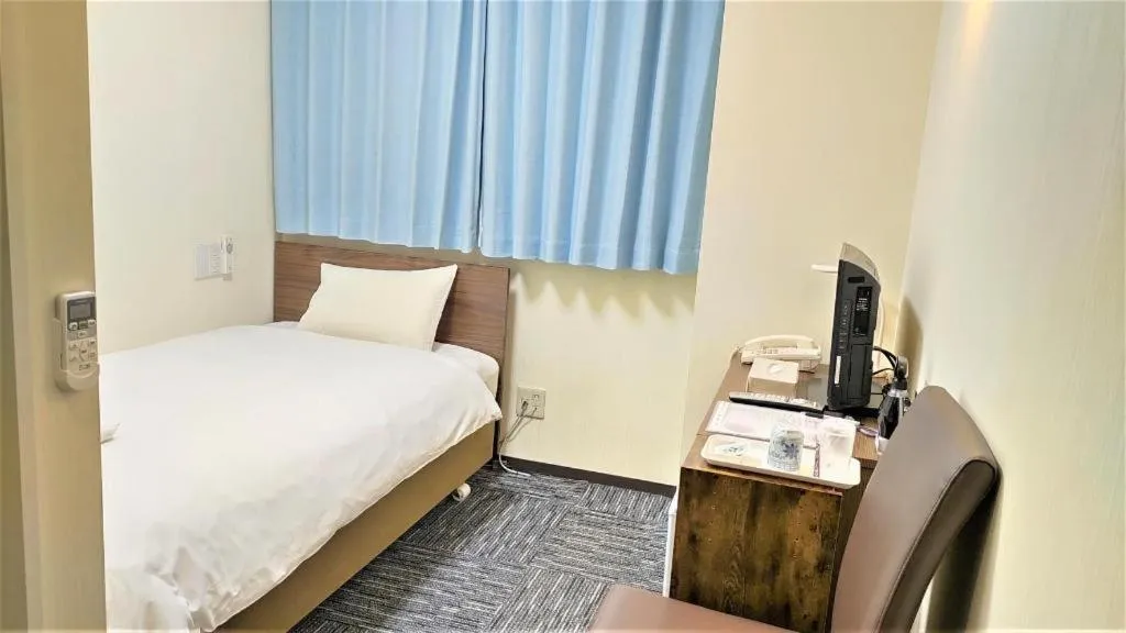 Bed in Ikebukuro Royal Hotel Higashiguchi